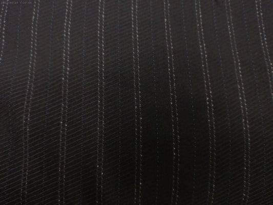 100% Wool worsted. Tropical weight.