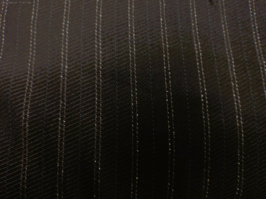 100% Wool worsted. Tropical weight.